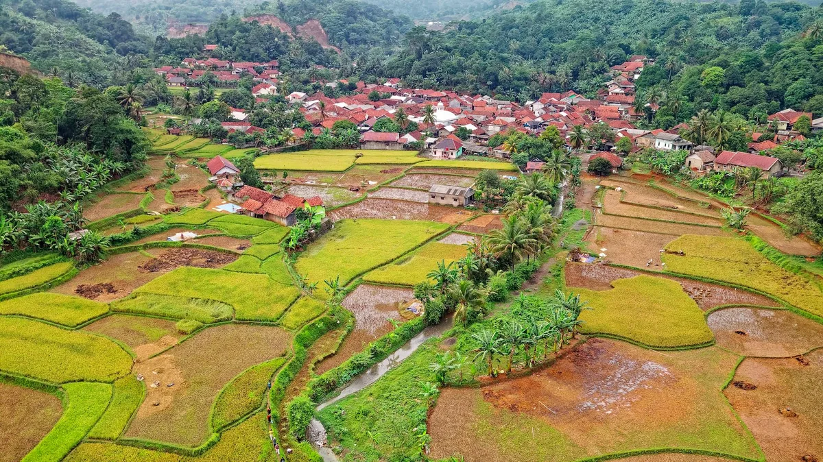 Traditional Ngada thatched houses with ceremonial structures in Bajawa highlands, Flores